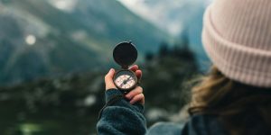 Woman holding compass